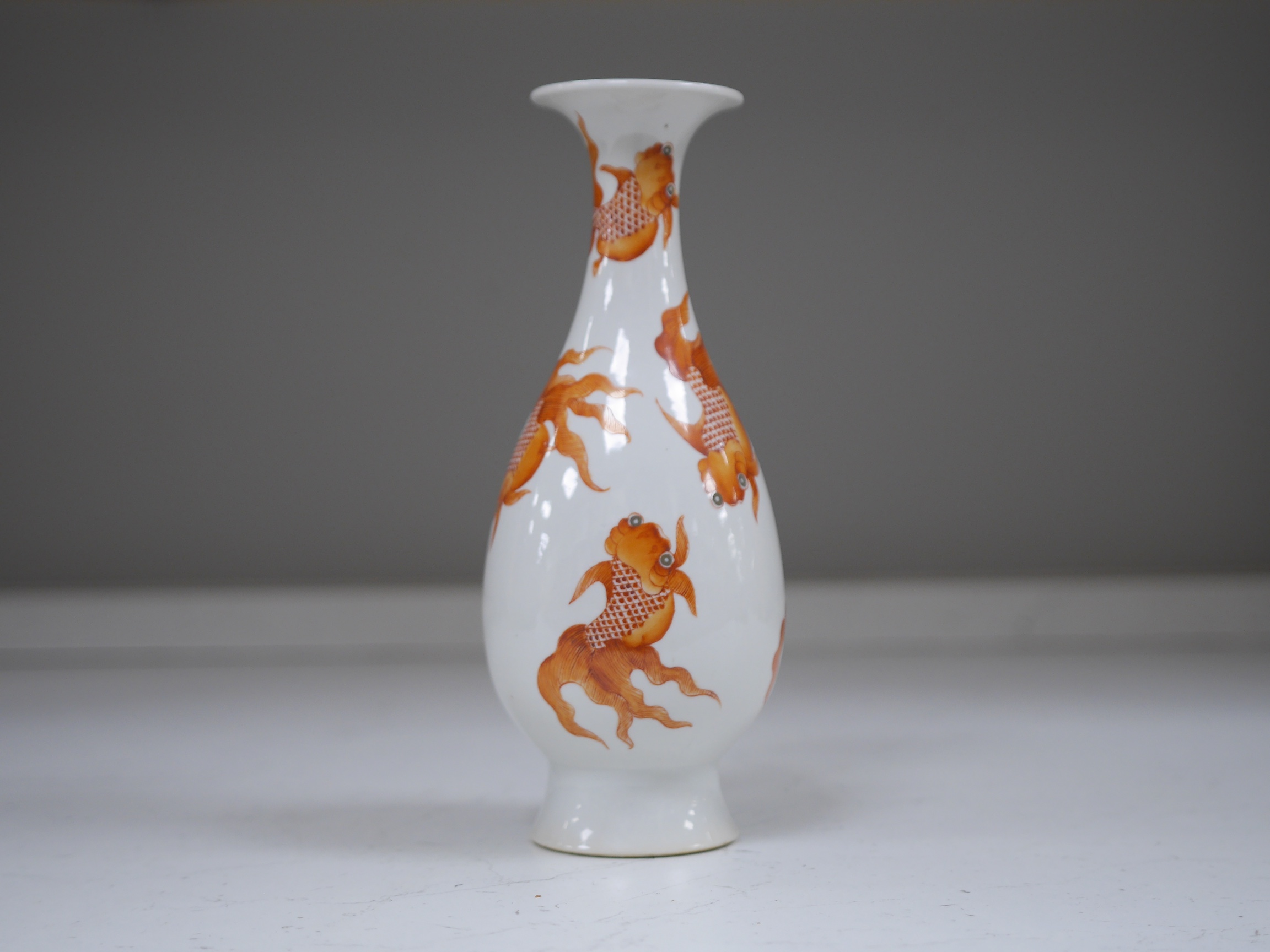 A Chinese iron red enamelled goldfish vase, 26cm high. Condition - good